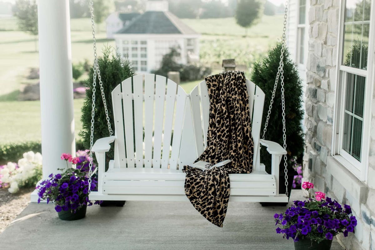 White signature swing on a front porch